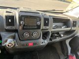 a dashboard of a truck with a clock on it