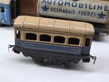 a toy train that is sitting next to other toy trains