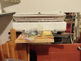 a kitchen with a sink, stove, and other items on the counter