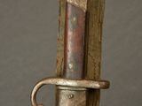 a close up of a sword with a metal handle