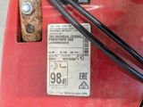 an image of a red lawn mower with a price tag on it