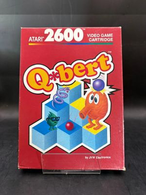 the box for the video game q - bert is sitting on the table