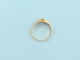 a close up of a gold ring on a blue surface
