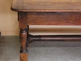 a wooden table with a wooden top and a wooden base