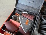 a tool box with tools in it sitting on the floor