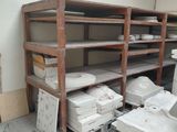 a room that has a lot of boxes and boxes on the shelves