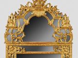 a mirror with a gold frame and a mirror with a mirror on it