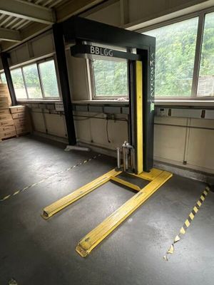 a fork lift in the middle of a large room