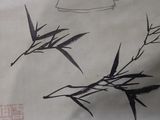 a drawing of a teapot and bamboo plant on a piece of paper