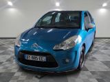 a picture of a blue car parked in a garage