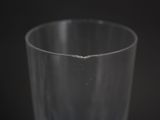 a close up of a glass of water on a black background