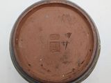 an image of a close up of a brown cup on a white surface