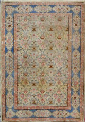 an antique rug with a blue border and a gold border