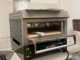 a toaster oven sitting on top of a counter in a kitchen