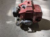 a small red machine that is sitting on the floor