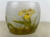 a glass vase with a yellow flower painted on it