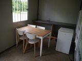 a small kitchen with a table and chairs in it