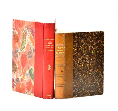 two books sitting next to each other on a white surface
