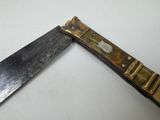 a knife that is laying on a table