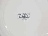 a white plate with a black and white design on it