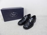 prada men ' s black leather dress shoes with silver buckles