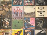 a collage of posters on the wall of a room