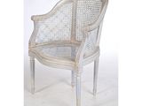 an image of a white wicker chair against a white background