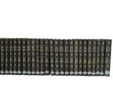 a large collection of old books sitting on top of each other