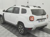 a picture of a white car parked in a garage