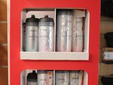 a red display case with cans and cans of paint on it