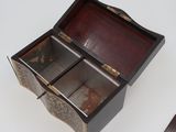 a small wooden box with two compartments on a table