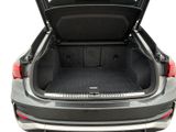 the back of a car with its trunk open showing the cargo compartment