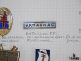 many badges on a piece of paper with writing on it