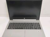 an open laptop computer sitting on top of a white table