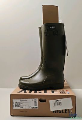 a box with a pair of rain boots on top of it
