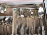 many spoons and spoons in a box with labels on them