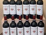 many bottles of wine sitting on a wooden crate