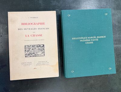 two books sitting on top of a table next to each other
