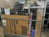 a metal cage with a box on top of it
