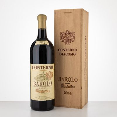 a bottle of wine sitting next to a wooden box