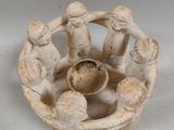 a small bowl that has a group of people in it