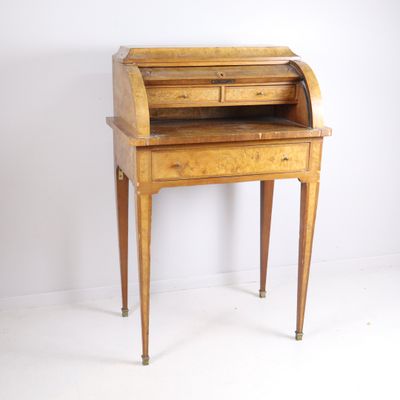 an old wooden desk with a drawer on top of it