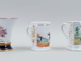 three different types of coffee mugs sitting next to each other on a table