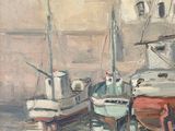 many boats that are docked in the water near a building