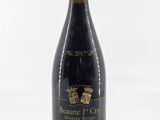 the bottle of wine is sitting on the table ready to be eaten