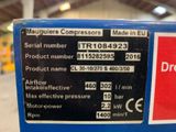a label on the side of a machine that is in a warehouse