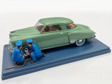 a green toy car with two men working on it