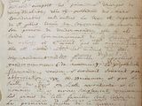an old book with writing on it sitting on top of a table