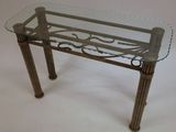 a glass table with a metal frame and a glass top