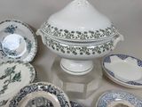 many different types of plates and bowls on the table